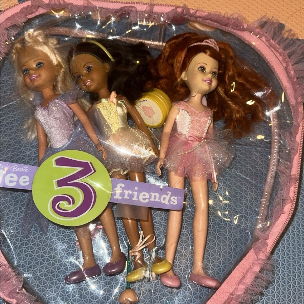 Three Barbie dolls